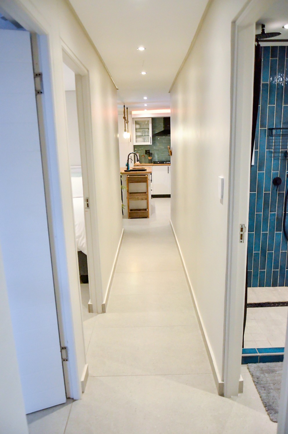 The hallway of the unit leading to the kitchen
