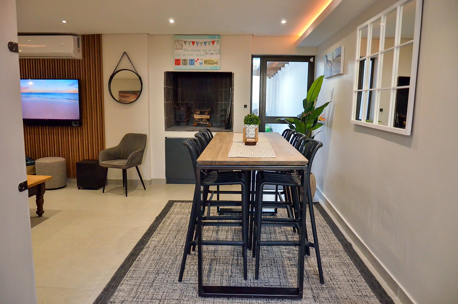 High dining table in front of the built-in braai